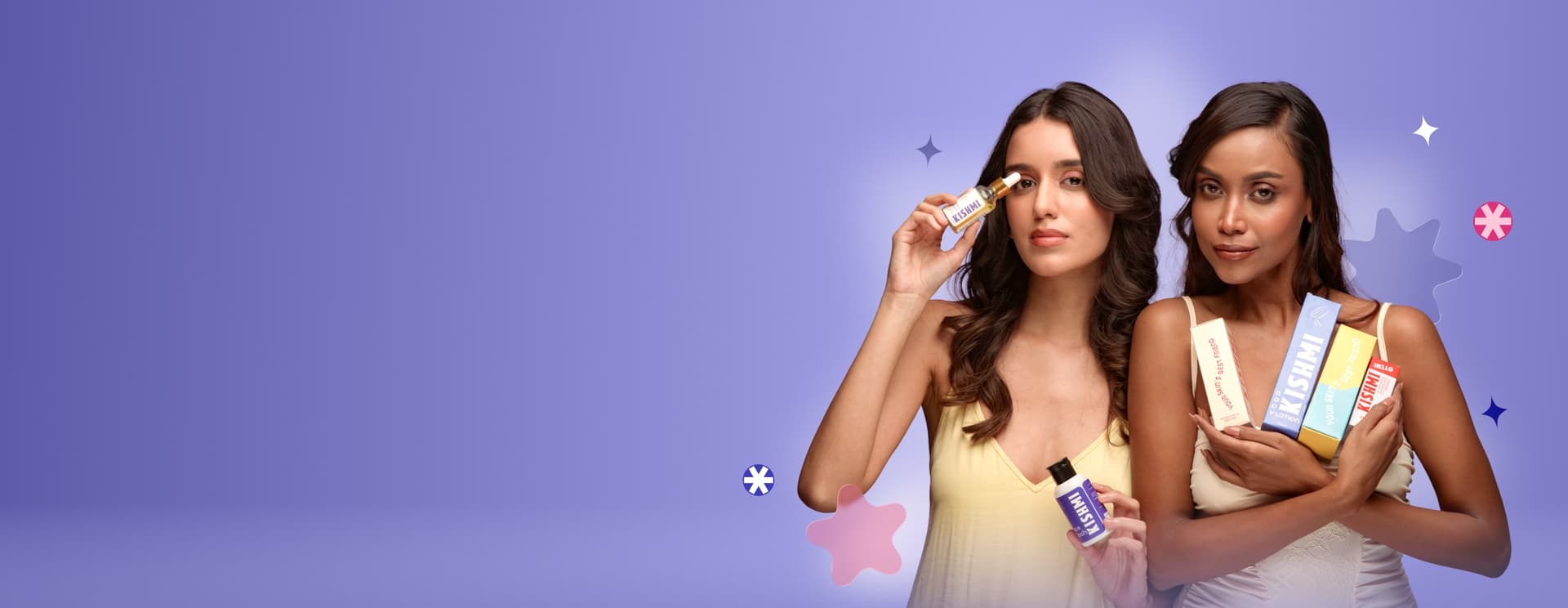 Two women holding Kishmi serums, cleansers and moisturisers